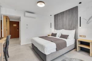 Posteľ alebo postele v izbe v ubytovaní Hotel Laurentum