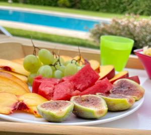 a plate of fruit on top of a table at VILLA SAVALIN in Taglio di Po