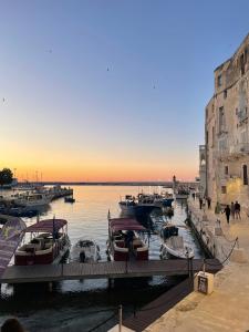 a group of boats are docked in a harbor at Casa Luna 23 in Monopoli