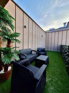 a patio with chairs and tables and a plant at EASY RENT Apartments- Business Center 205, Free Parking, 24h Check-in in Lublin