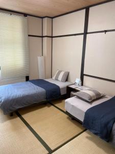 Postel nebo postele na pokoji v ubytování Hilo Hostel