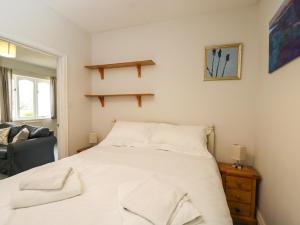 Ένα ή περισσότερα κρεβάτια σε δωμάτιο στο Garden Cottage