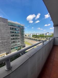 a balcony with a view of a building at Apartament Superjednostka in Katowice