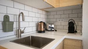 a kitchen with a sink and a counter top at Apartamento costa del sol in Torremolinos +4 photos