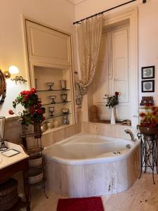 a bathroom with a large tub in a room at Attico Vista Mare Trapani in Trapani +82 photos