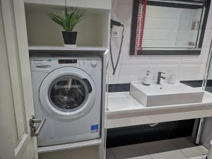 Koupelna v ubytování Flame Luxus Apartman