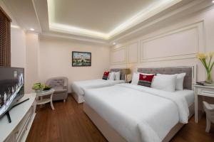 Postel nebo postele na pokoji v ubytování Sapa Praha Hotel
