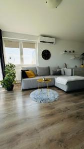 a living room with a couch and a table at Classy Villány in Villány