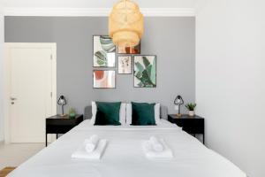 Ein Bett oder Betten in einem Zimmer der Unterkunft GuestReady Holiday Homes - Light Abode