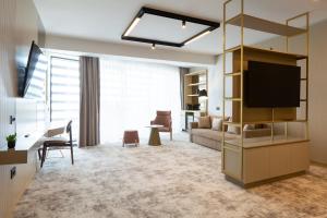 TV a/nebo společenská místnost v ubytování Hotel Lupa by Bueno