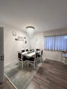 a dining room with a table and chairs at Vacation home in Marginea