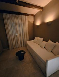 A bed or beds in a room at Locanda