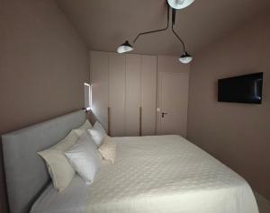 A bed or beds in a room at Locanda