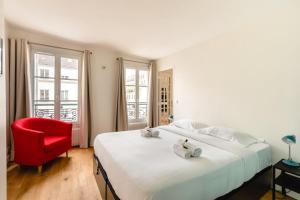 Posteľ alebo postele v izbe v ubytovaní GuestReady - Estadia tranquila em Le Marais