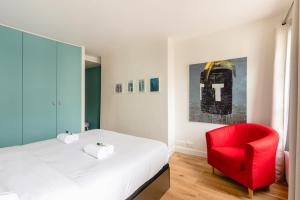 Posteľ alebo postele v izbe v ubytovaní GuestReady - Estadia tranquila em Le Marais