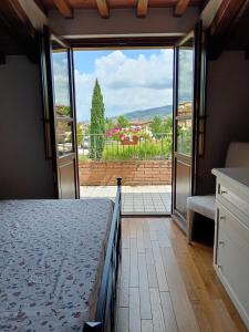 Ένα ή περισσότερα κρεβάτια σε δωμάτιο στο la casa di Debora