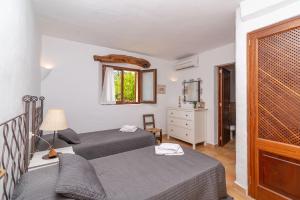 Posteľ alebo postele v izbe v ubytovaní Villa Cal Beato by Sealand Villas