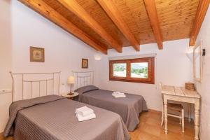 Posteľ alebo postele v izbe v ubytovaní Villa Cal Beato by Sealand Villas