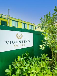 a sign for the villa sigintino suites at Vigentino Suites in Milan