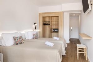 a bedroom with two beds in a room at htop Amatista #htopBliss in Lloret de Mar