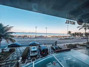 a view of a parking lot next to a beach at Sol Ipanema Hotel in Rio de Janeiro