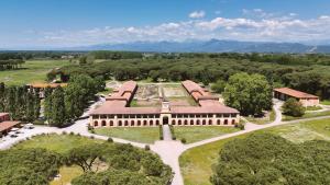 an aerial view of a building with trees at Casale La Sterpaia in Pisa