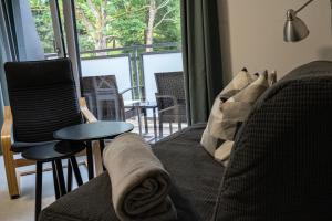 a living room with a couch and a table at Apartmán Emilka in Janov nad Nisou