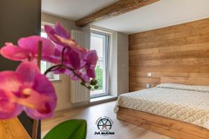 Postel nebo postele na pokoji v ubytování Residenza SUL MULINO