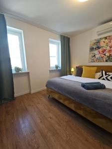 Posteľ alebo postele v izbe v ubytovaní Apartmány Centro & Jacuzzi