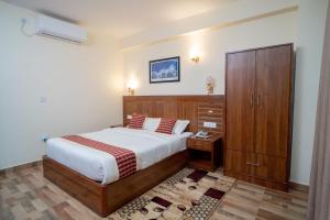 Voodi või voodid majutusasutuse Madhuban Hotel toas