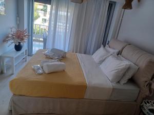 Posteľ alebo postele v izbe v ubytovaní L'appartement blanc dans le centre de Glyfada + 37 fotografií