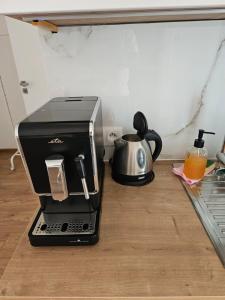 Príslušenstvo na prípravu kávy alebo čaju v ubytovaní Apartmány Centro & Jacuzzi