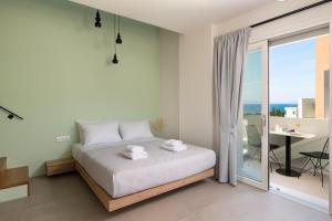 Ein Bett oder Betten in einem Zimmer der Unterkunft Rhodes Island View
