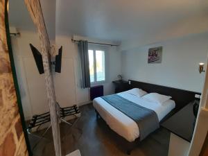 Postel nebo postele na pokoji v ubytování Hotel Au Spatial
