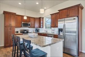 a kitchen with wooden cabinets and stainless steel appliances at 10333 Monticello Dr in Port Charlotte