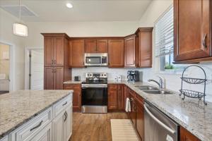 a kitchen with wooden cabinets and a stove top oven at 10333 Monticello Dr in Port Charlotte