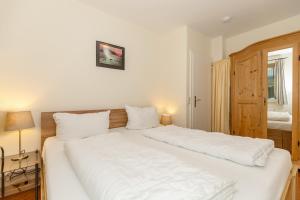 Ein Bett oder Betten in einem Zimmer der Unterkunft Meeresblick Meeresblick 206