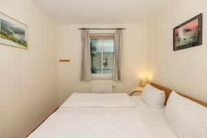 Ein Bett oder Betten in einem Zimmer der Unterkunft Meeresblick Meeresblick 206