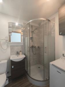 a bathroom with a shower and a sink at Sky View in Marijampolė