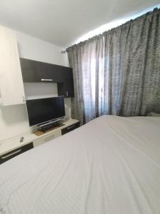 Postel nebo postele na pokoji v ubytování Romana Arad