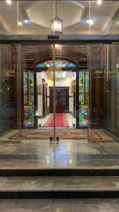 a building with stained glass windows and a lobby at Dahlia Sohar Hotel Apartments in Sohar