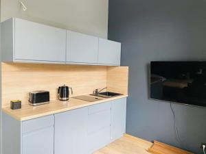 Kuchyňa alebo kuchynka v ubytovaní Nowy apartament studio Długa
