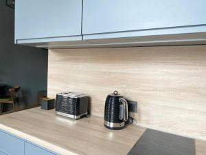 Kuchyňa alebo kuchynka v ubytovaní Nowy apartament studio Długa