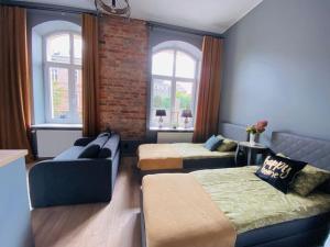 Posteľ alebo postele v izbe v ubytovaní Nowy apartament studio Długa