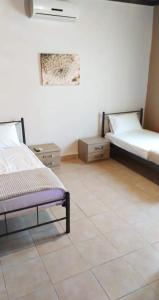 Ένα ή περισσότερα κρεβάτια σε δωμάτιο στο Kallikrateia's villa next to the sea +10 φωτογραφίες