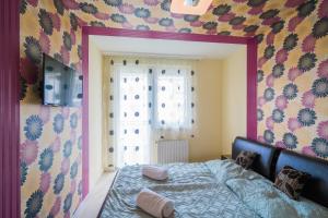 a bedroom with a bed in front of a window at ★ BB Wellness Apartman ★ in Siófok