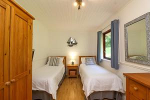Ένα ή περισσότερα κρεβάτια σε δωμάτιο στο Bay Tree Lodge 35
