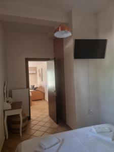 a bedroom with a bed and a room with a bed sqor at Studio Καρπώ Karpo in Galaxidi +18 photos