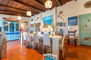 a dining room with a table and chairs at Villa Tiziana in Costa Rei