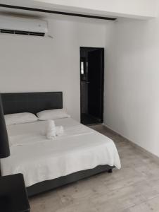 Postel nebo postele na pokoji v ubytování Hotel Ozzy